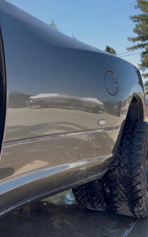 Pickup truck exterior covered in dirt before detailing