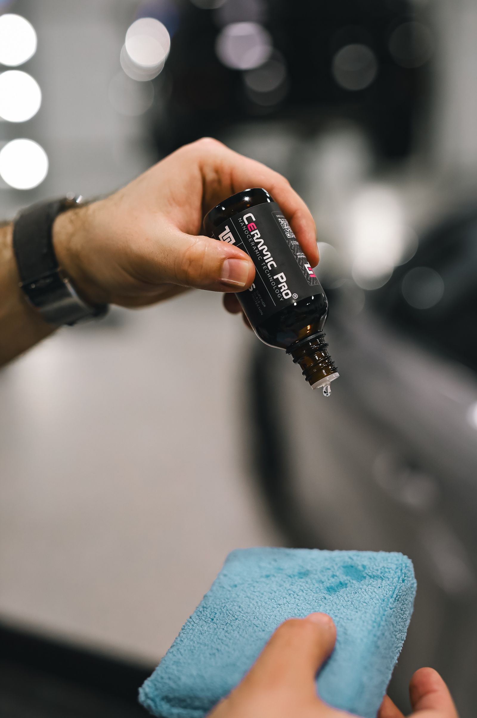 Detailer applying ceramic coating onto an applicator pad